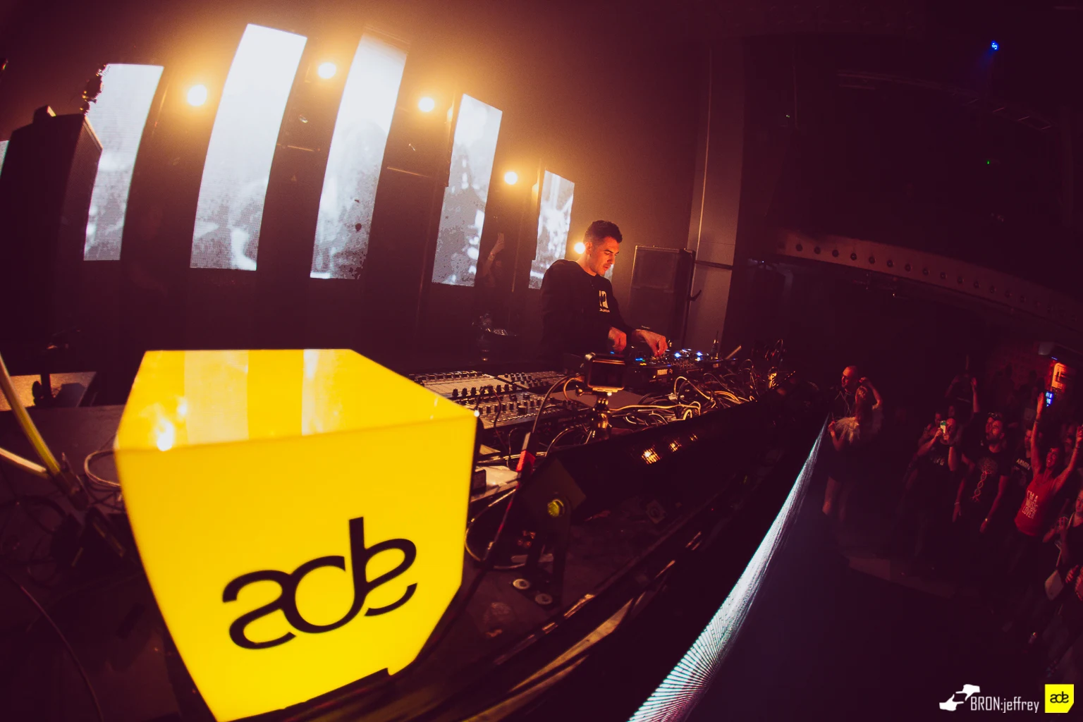 DIM3NSION DJing beside the yellow ADE cube at Panama