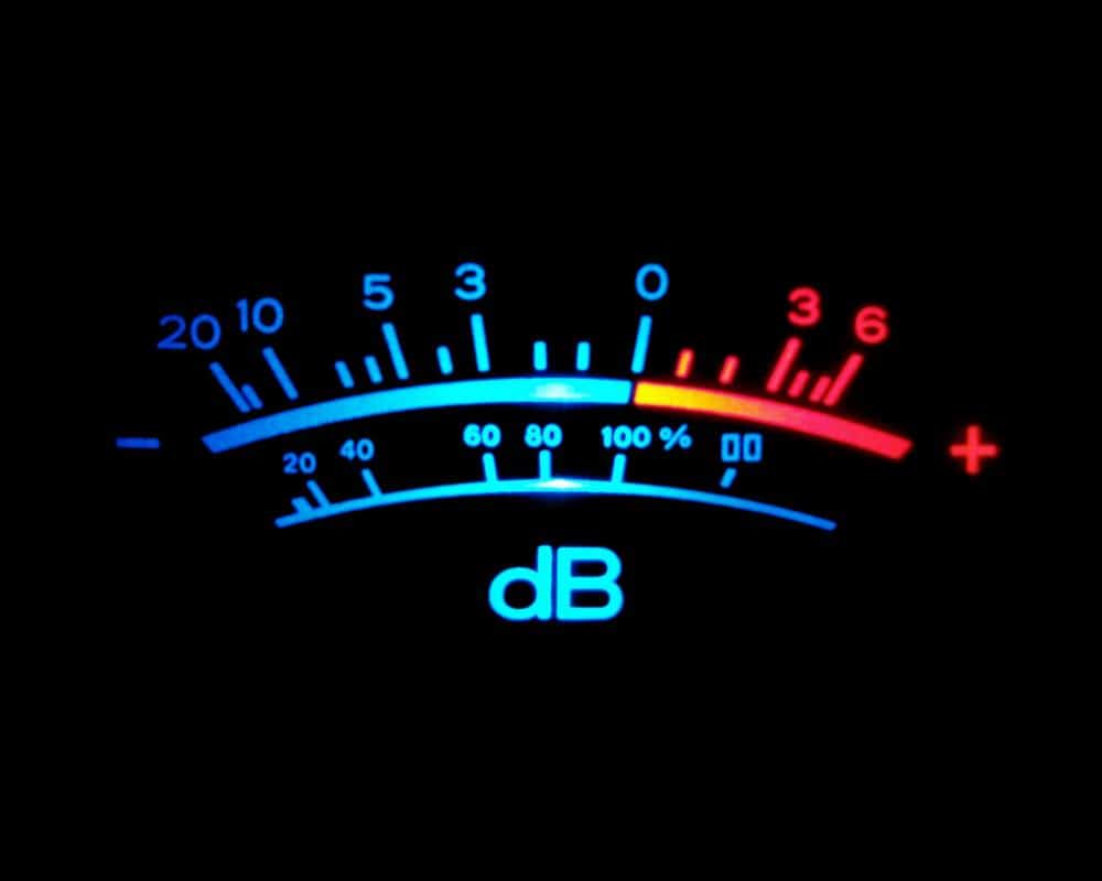 Illuminated VU meter showing decibel level markings